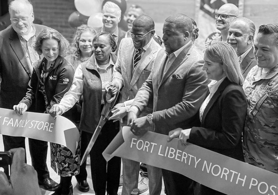kathy roth-douquet and others cutting the tape at fort liberty starbucks