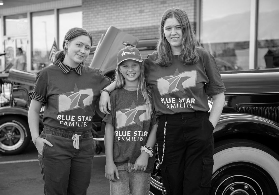 various aged youth posing outdoors at a blue star families event